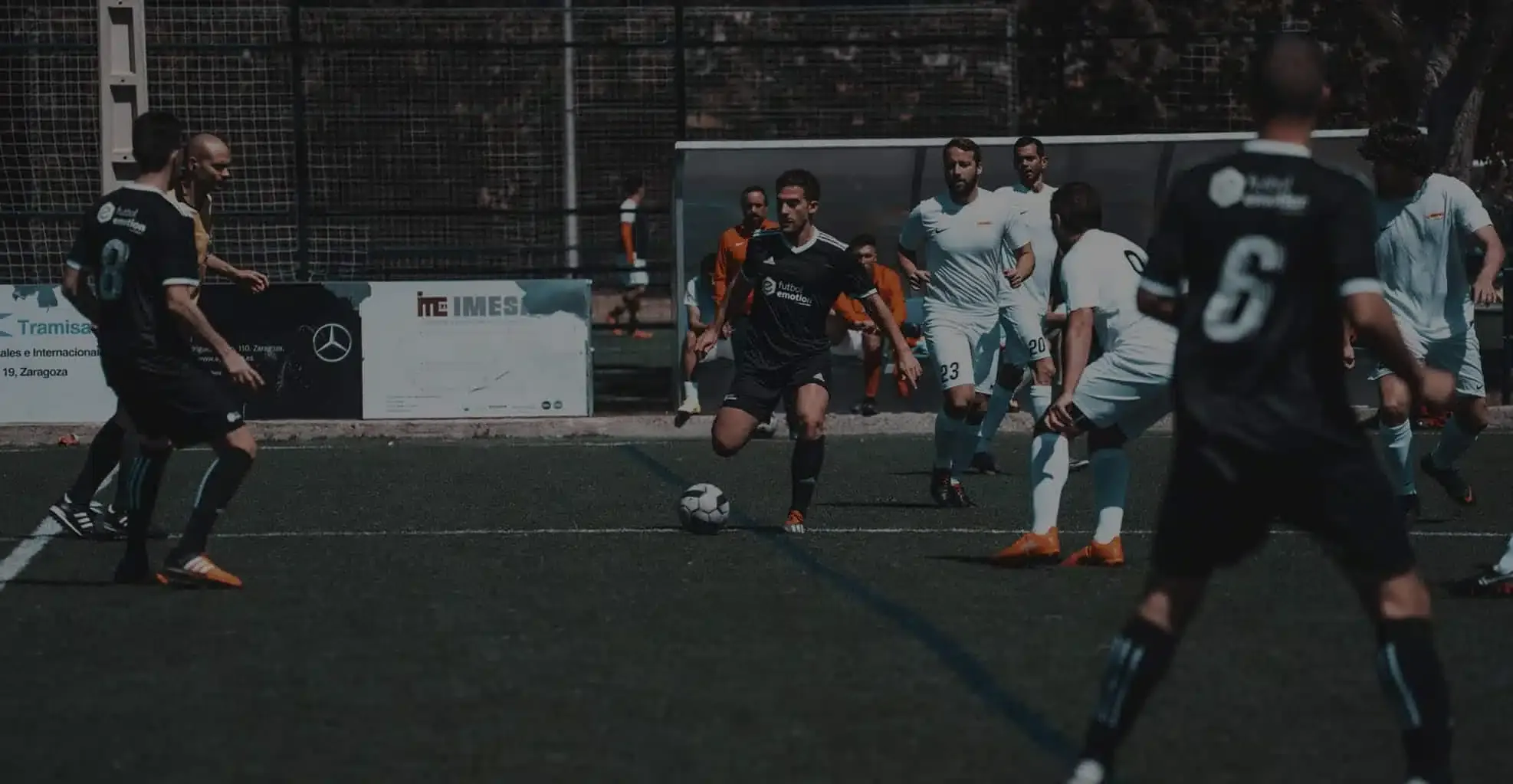 Players competing in an amateur football match